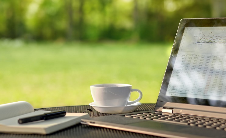 Laptop and coffee in outdoor office